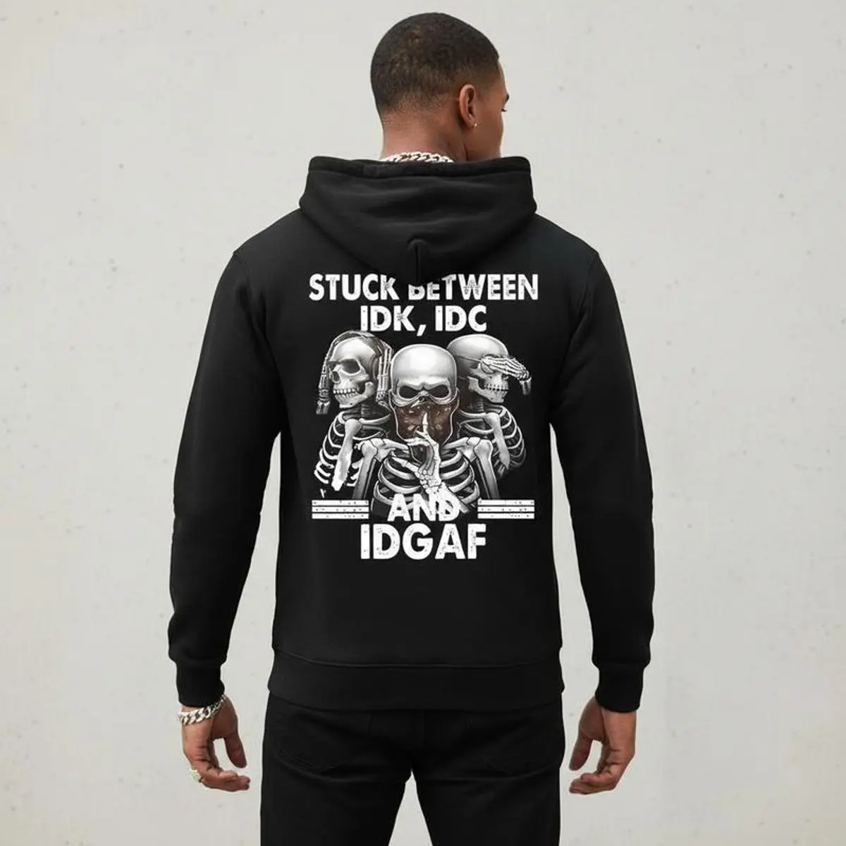 Stuck Between Idk Idc And Idgaf Hoodie, Sarcastic Skull Graphic Sweatshirt, Dark Humor Attitude Streetwear Shirt, Edgy Statement Back Print Tee, Unisex Sweater Pullover Tee