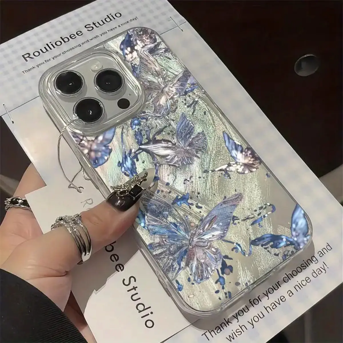 Rouliobee Studio Glossy Blue Silver Butterflies TPU PET Phone Case, Multi-Model Accessory for iPhone 17,16,15,14,13,12,11 Series, Aesthetic Shockproof Cellphone Casing