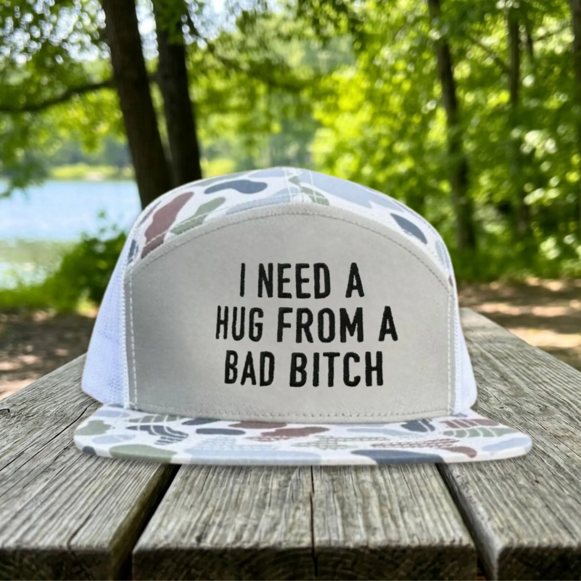 I Need A Hug From A Bad Bitch Trucker Hat, Funny Sarcastic Snapback, Offensive Humor Cap, Gift for Him, Camouflage 7-Panel Hat