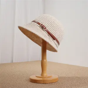 Handcrafted grass hats.Womens hollow crocheted bucket-shaped sun hats with leather belt and metal ring decorations,breathable wide brim sun hats providing UV protection.Lightweight, foldablecasual headwear suitable for summer beach trips and everyday wear