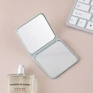 REK Cosmetics Compact Mirror with 1x & 2x Enlargement for On-the-Go Beauty Routine Sleek Design Easy to Carry in Purse