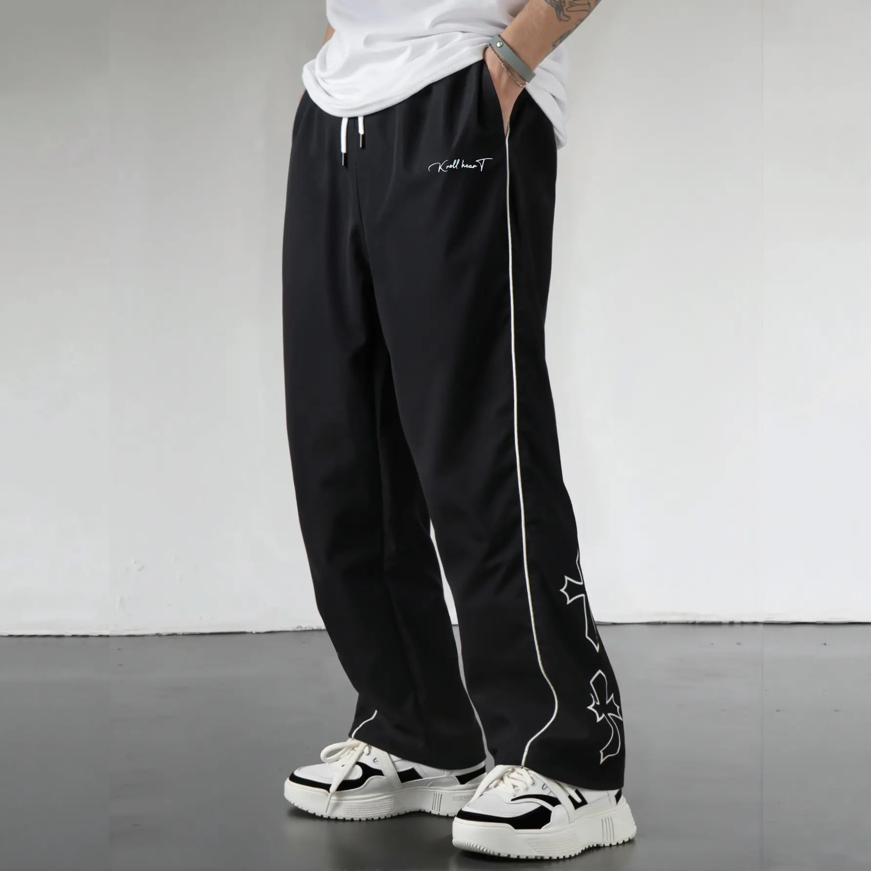 Men’s wide-leg pants with a cross print, lightweight streetwear track pants with side stripes, elastic waist drawstring casual pants for hip hop, Y2K, and everyday wear, Activewear, Trouser, Sportswear, Athletic tiktokshopspringglowup