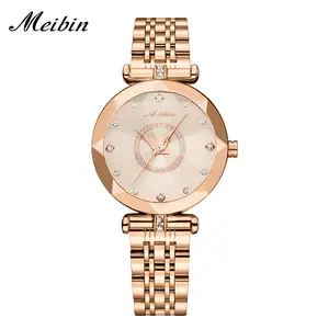 Multi-faceted cut case, sunburst textured dial, sparkling stone markers and inner ring, polished metal bracelet with crystal links, sleek feminine design perfect for elevating casual and formal outfits