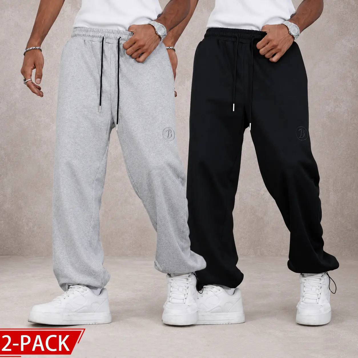 2-pack cuffed sweatpants; textured athletic pants; wide-leg athletic pants with elastic waistband; loose-fit athletic pants with embossed logo; casual pants with adjustable cuffs; casual street-style athletic pants; sporty gym pants; everyday loose-fit pa