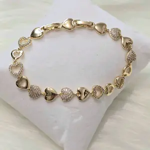 Pulsera de corazones dorados con zc y calados 6.5 - 7 inch