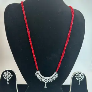 Red hydro potey long sized Nepali Mangalsutra with earrings.