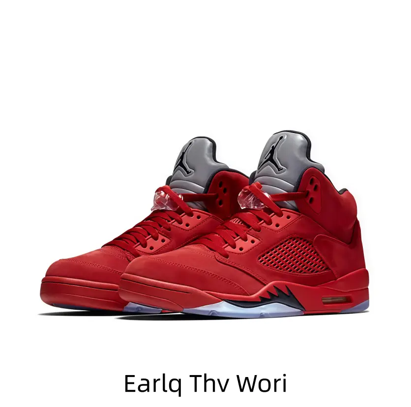 Bold full-red suede high-top athletic shoes with gray tongue panel, black mesh breathable side inserts, icy translucent outsole, shark tooth side trim and visible heel air cushion unit.