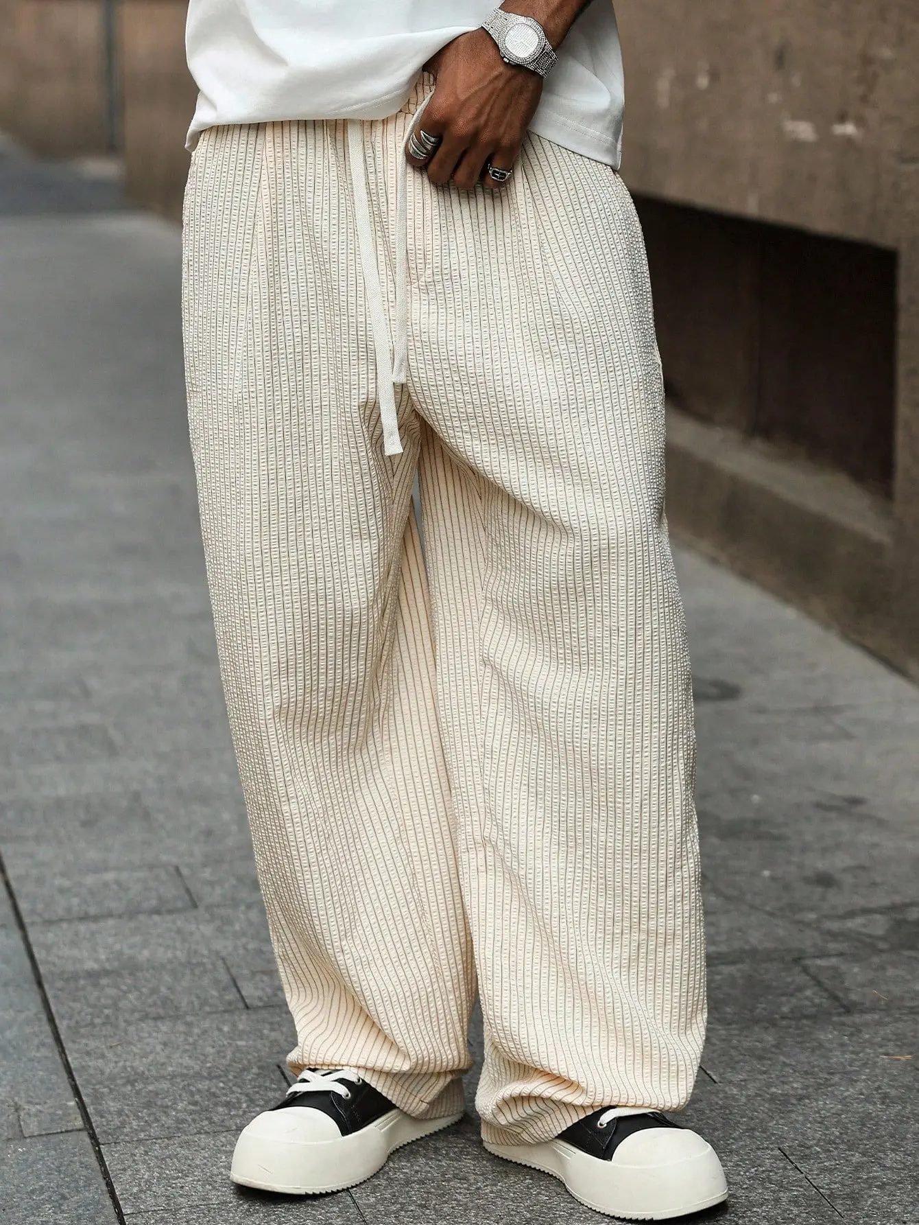 Men’s light apricot wide-leg pants with vertical stripes – 3D bubble texture, natural drawstring waist, relaxed drapey fit, minimalist Y2K summer trousers for city outings