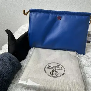 Pre-owned HERMÈS LambSkin Small Leather Goods Blue Pilo Pouch crafted from Milo lambskin