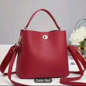 Red Leather Bucket Bag with Detachable Strap and Gold Hardware for Everyday Use