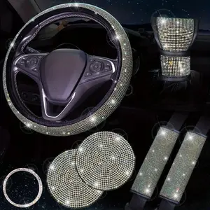 7-piece set of luxury car interior accessories, including diamond steering wheel cover, shiny crystal seat belt and shift cover, and cup holder.