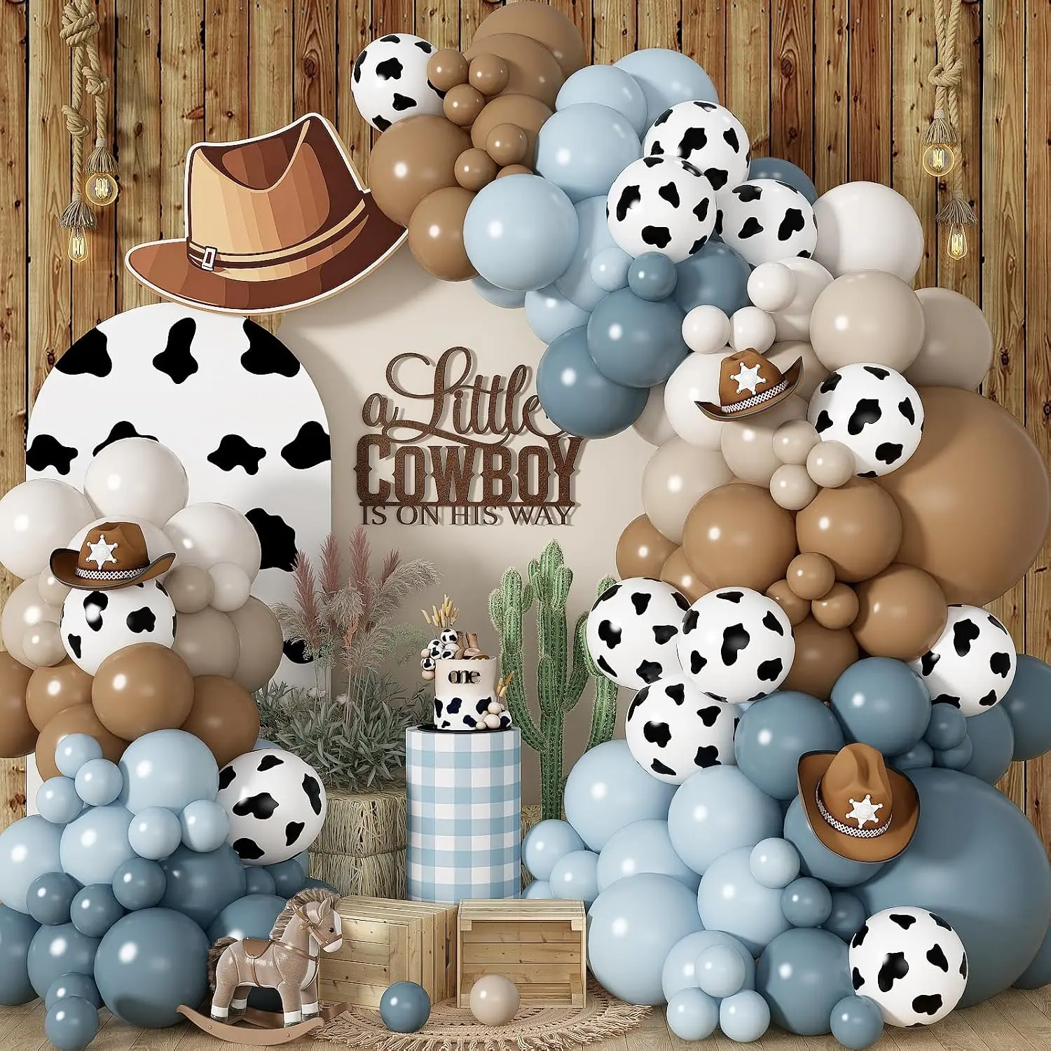 Little Cowboy Party Decorations - Blue and Brown Balloon Arch with Cow Print Balloons and Cowboy Hats for a Western Theme