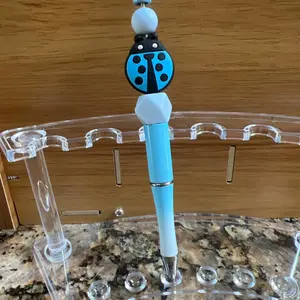 Blue Lady bug focal on Blue pen