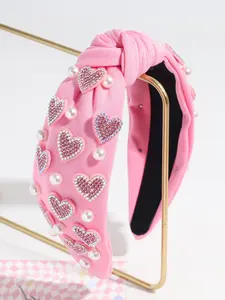 This exquisite and beautiful heart-shaped faux pearl headband for women is the perfect gift for friends and family.  It's suitable for elegant occasions, everyday wear, and is an ideal choice for Valentine's Day. Headbands Women