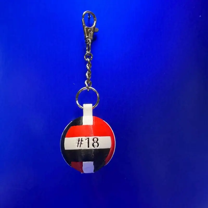 Volleyball Keychain – Black/White/Red with Personalized Player Number.