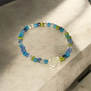 Blue flower with blue and green seed beads-handmade bracelet