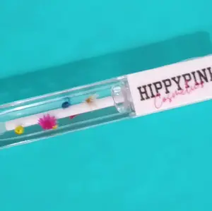 hippy pink signature gloss | blossom floral clear gloss