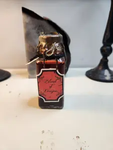 Thicket Hill Games, Dragon's Blood Potion Ingredient Bottle, Perfect as a Halloween Decoration or to enhance your TTRPG Game, liquid is made from colored water and mica powder, features a sword charm and wax seal. Accessories Masks
