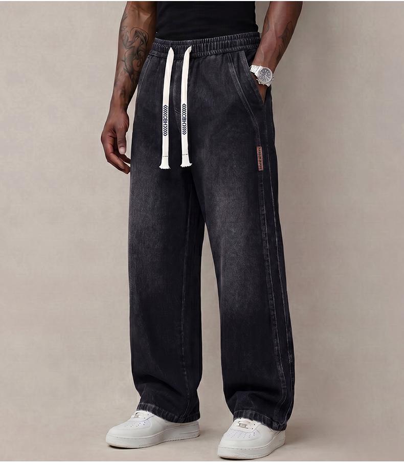 Men’s jeans made from stretchy cotton—comfortable and stylish. Loose fit for everyday wear; long pants with a drawstring elastic waistband design for men.