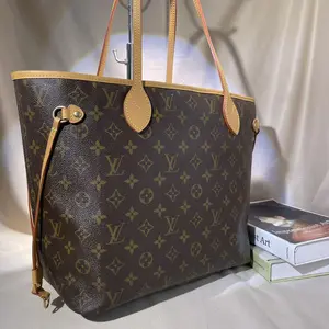 Pre-owned Louis Vuitton Monogram Neverfull MM Tote Bag Iconic Coated Canvas & Vachetta Leather 13 inch Laptop Friendly Hand sewn Craftsmanship Authentic Pre owned