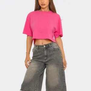 Romi Top - 100% Cotton This crop top is defined by its all-over rhinestone embellishments that provide a subtle, It typically features a crew neck, dropped shoulders, and a boxy, cropped fit. Various versions are crafte