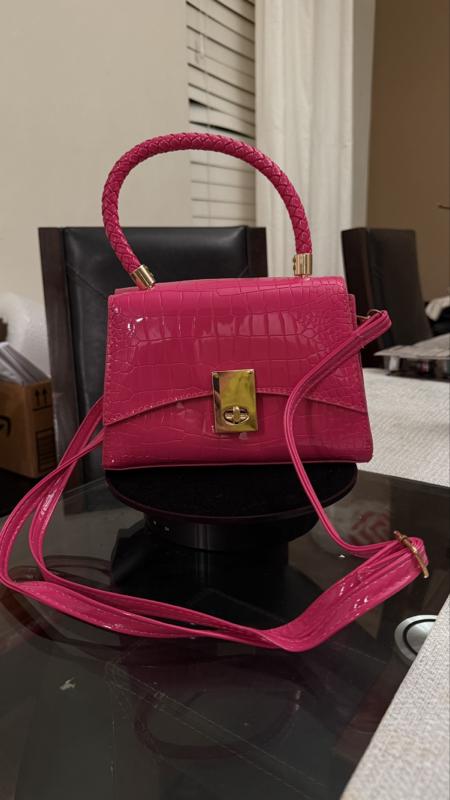 Elegant Pink Handbag with Gold Accents and Secure Closure for Everyday Use