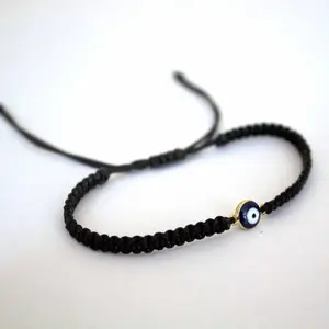Handwoven Macrame Bracelet with Evil Eye Charm - Handcrafted Adjustable Wristband for Everyday Wear