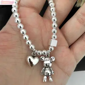 Silver Beaded Bracelet with Bear and Heart Charms Vintage Love & Peace Engraved Pendant Women's Statement Jewelry Elegant Design Versatile Accessory Perfect Gift