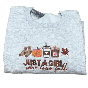 Just a Girl Who Loves Fall Embroidered Sweatshirt – Cozy Autumn Design with Pumpkin, Coffee, Candle and Leaf, Cute Unisex Fall Pullover, Perfect Gift for Her, Friends or Fall Birthday