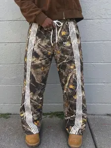 Unisex Camo Print Baggy Sweatpants with Yellow Maple Leaf Pattern, Trendy Loose Fit Joggers for Men and Women in Street Style and Athleisure Outfits