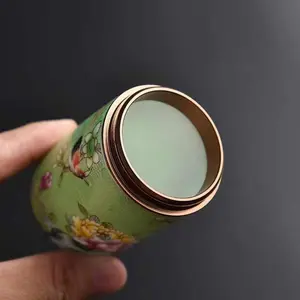 The enamel craft ceramic tea canister is a storage container that combines porcelain with enamel techniques. Bottles Leaf