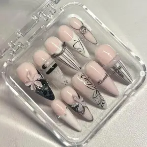 Handmade Black Stiletto Nails with Elegant Bows Fine Line Art & Metallic Accents Glossy Finish Perfect for Classy Sophisticated Statement