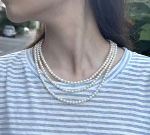 NC033-The Regent Triple Strand Pearl Necklace – A Luminous Cascade of Freshwater Pearls. Triple Strand Pearl Necklace, Three Row Pearl Necklace, Layered Pearl Necklace, Multi-Strand Pearl Collar, Freshwater Pearl Necklace, Classic Pearl Choker