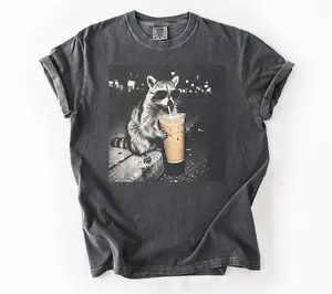 [ Sale Up To 40%] Comfort Colors Raccoon Drinking Iced Coffee Shirt | Funny Animal Meme Tee | Coffee Lover Raccoon Shirt | Unisex Graphic T Shirt