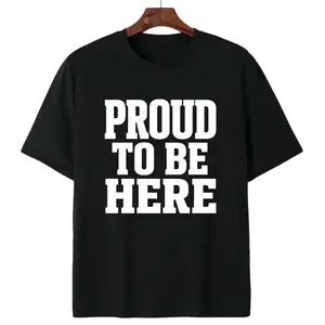 Unisex Patriotic Bold Letter Graphic T-Shirt With Proud To Be Here Distressed Stacked Print For National Holiday Gatherings And Outdoor Independence Day Activities