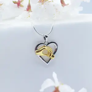 Child Holding Mom Hands Heart Pendant Necklace