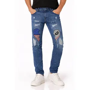 Men’s slim-fit stretch denim jeans with American flag ghost face embroidery and distressed details, washed finish, street Y2K style, long pants for all seasons—ideal for men’s parties and everyday wear.