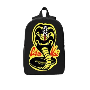 Classic Cobra Logo 17-Inch Laptop Backpack — Durable polyester material featuring breathable shoulder straps, two-way zippers, and side pockets; an ideal choice for school, travel, and karate enthusiasts.