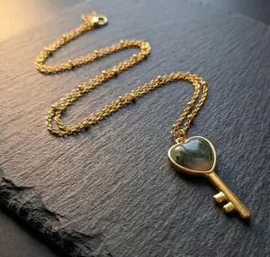 Dragon's Blood Heart Key Necklace PVD Stainless Steel with Gold Chain and Unique Design
