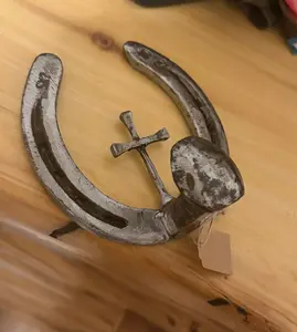 Horseshoe cross coat hanger