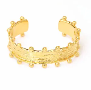 Raina Studded Cuff - Gold-Colored Braided Bracelet with Studs, Adjustable Design, and Elegant Style