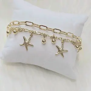 7.5-8.5 inches Pulsera doble con estrellas de mar colgando y balines. Laminado de alta calidad.