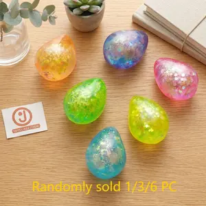 Teardrop-shaped stress-relieving ball with a squeezing action, Soft Squishy Silicone. Sparkling design, transparent jelly-like appearance. Squeeze repeatedly to soothe emotions. Suitable for office, home, and travel. Makes a great holiday or party gift.