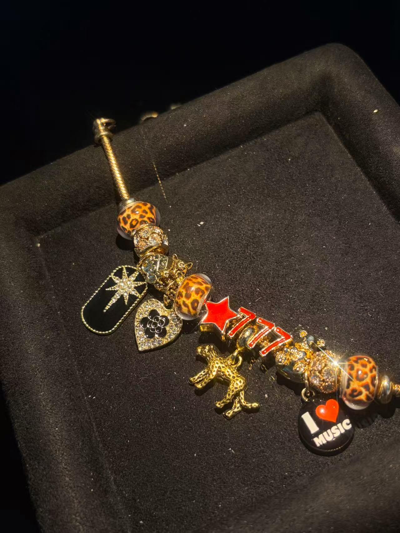 Women's Gold-Tone Multi-Charm Beaded Bracelet - Leopard Print Bead, Star, I Love Music Dangles - Trendy Costume Fashion Jewelry Accessory Women's Gold-Tone Multi-Charm Beaded Bracelet - Leopard Print Bead, Star, I Love Music Dangles - Trendy Costume Fashion Jewelry Accessory