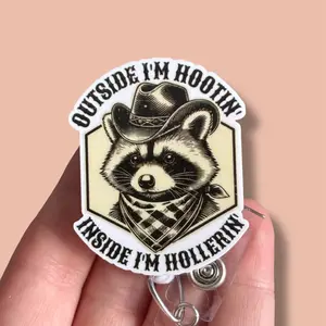Glitter My Badge Inside I’m hootin outside I’m hollerin Raccoon badge reel for nurse and hospital workers. Badge clip Badge pull - Retractable swivel clip with a 360 rotation. Great gift for coworker.
