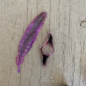 Purple feather book mark and thumb page holder
