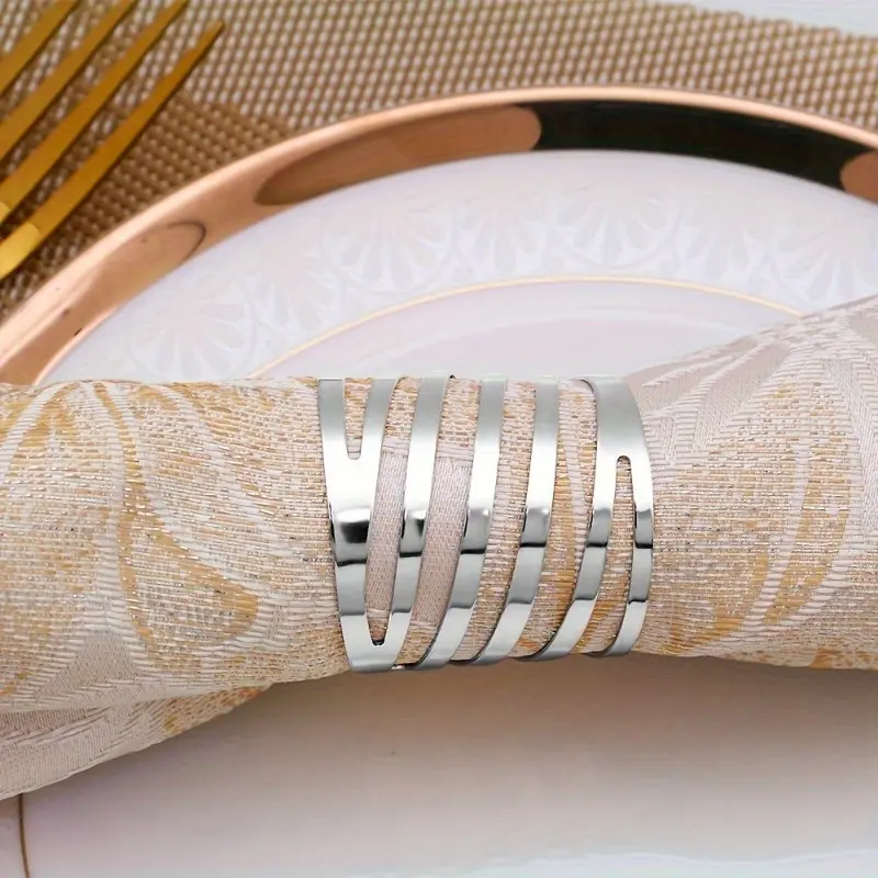 4pcs Elegant Golden Napkin Rings With A Slanted Design, Featuring A Simple And Stylish Circular Opening, Perfect For High-end Hotel Dining Tables And Wholesale Napkin Ring Purchases.