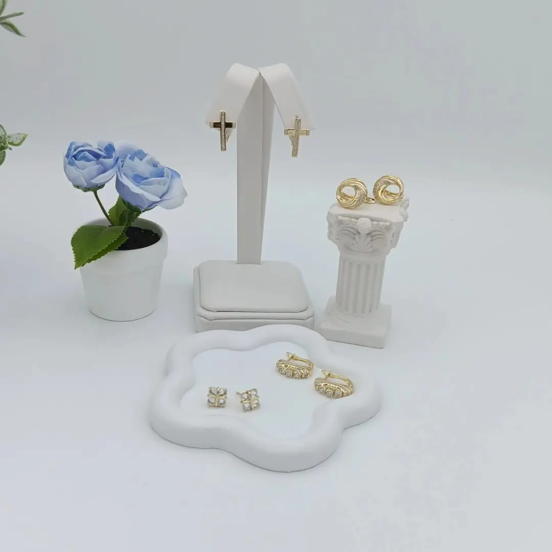 Various designs of 14k golden plated earrings. High quality Various designs of 14k golden plated earrings. High quality