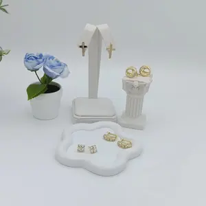 Various designs of 14k golden plated earrings. High quality