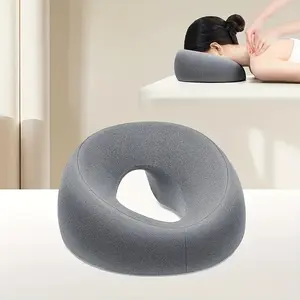 Soft O-shaped facial pillow for beauty salon, bed pillow for beauty treatment, special pillow for adult facial care and relaxation.